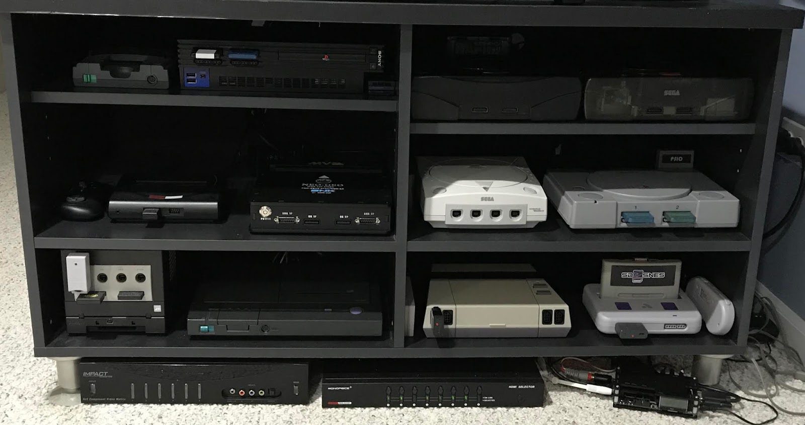 Retro video game consoles in an entertainment center