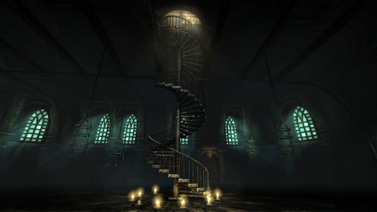 A dimly lit spiral staircase in Amnesia: The Dark Descent.