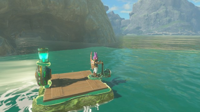 Link riding a raft outside Cape Cales Cliffside Cave in The Legend of Zelda: Tears of the Kingdom.