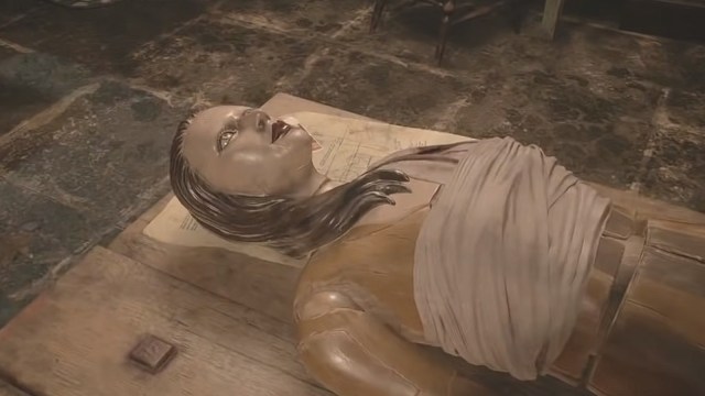 assembling a creepy human doll in Resident Evil VIII