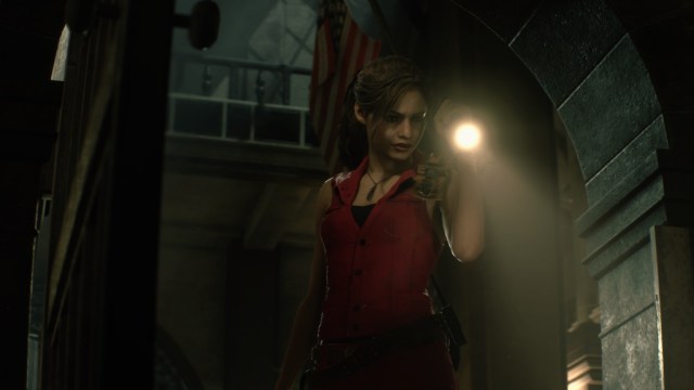 Claire Redfield holding a flashlight in Raccoon City Police Department.