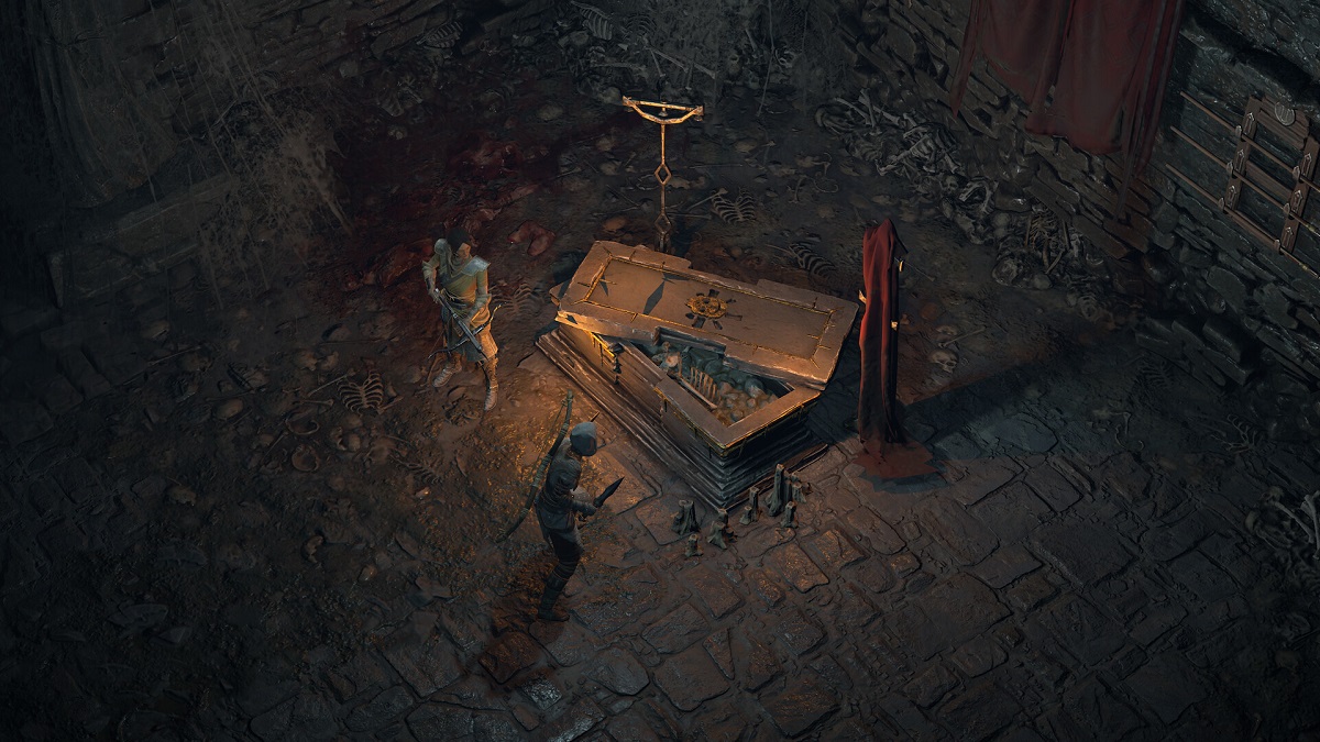 Diablo 4: two players look at a half-open coffin.