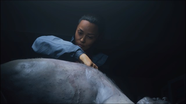 Saga Anderson performing autopsy in Alan Wake 2.