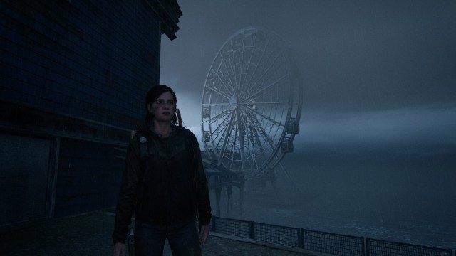 Ellie in front of Ferris Wheel in The Last of Us 2.