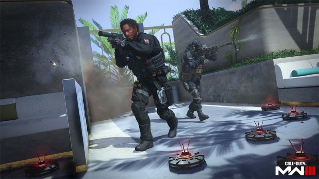 MW3 players running through a set of mines firing weapons.