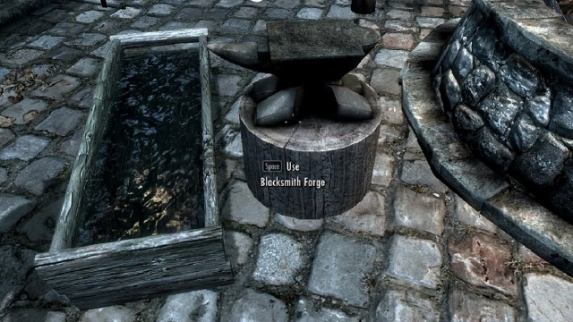 Screenshot from Skyrim showing a forge next to a trough of clear water.