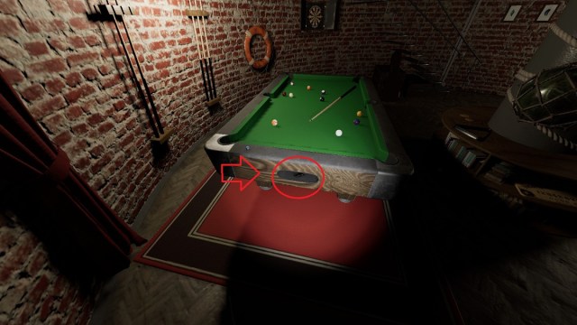 Phasmophobia: a pool table with a red arrow and circle showing where a key has come out.