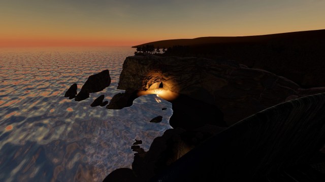 Phasmophobia: a view of the beach showing a cavern with a light coming from it.