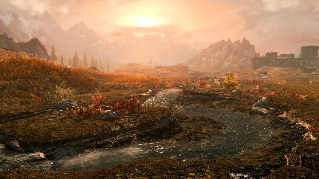 Skyrim: a beautiful screenshot showing a setting sun that highlights a nearby river.