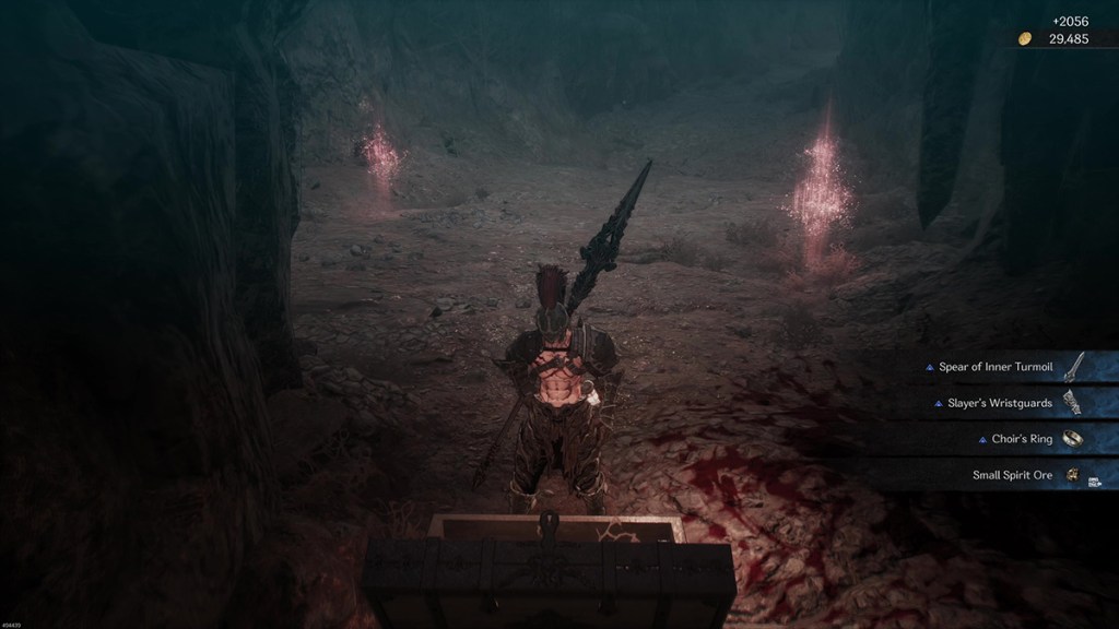 Khazan opening a treasure chest across from a hallway