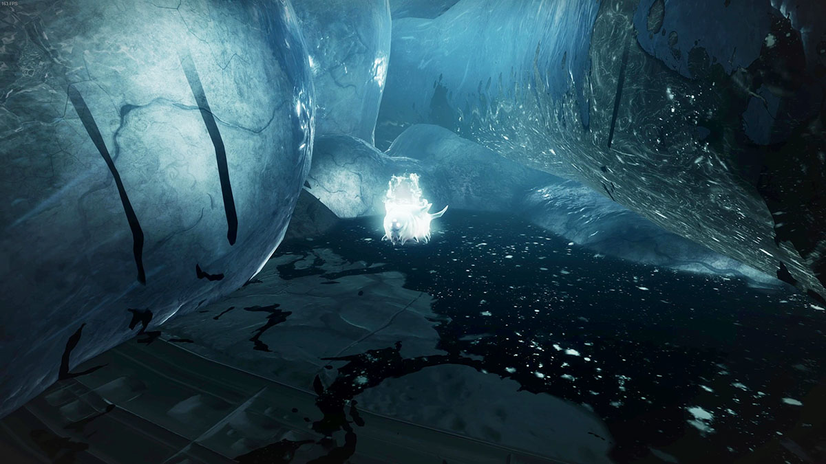 A large, glowing white worm sitting between two large, blue tentacles