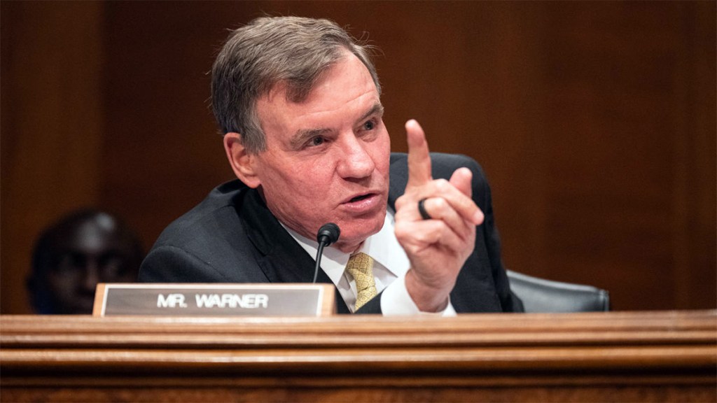 Senator Mark Warner with raised finger