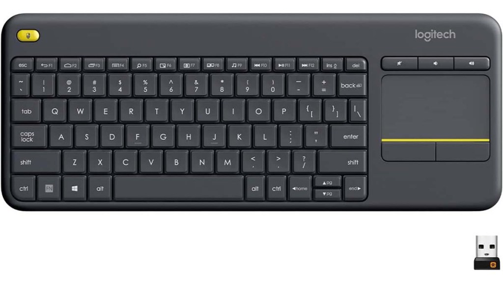 The Logitech K400 keyboard, with a side mouse pad and its bluetooth adapter.