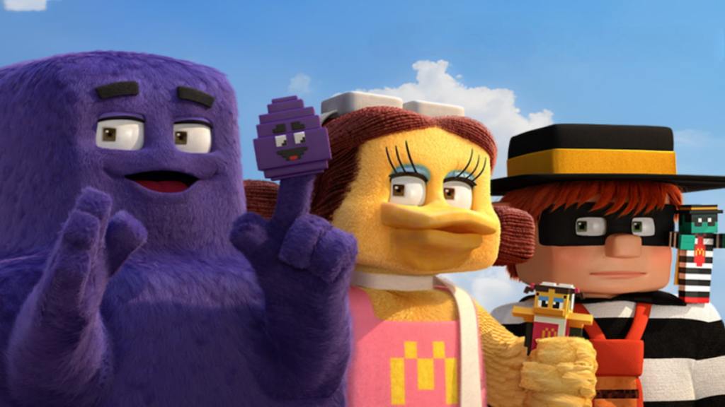 Grimace, Birdie, and the Hamburglar with their Minecraft Movie collectibles. 