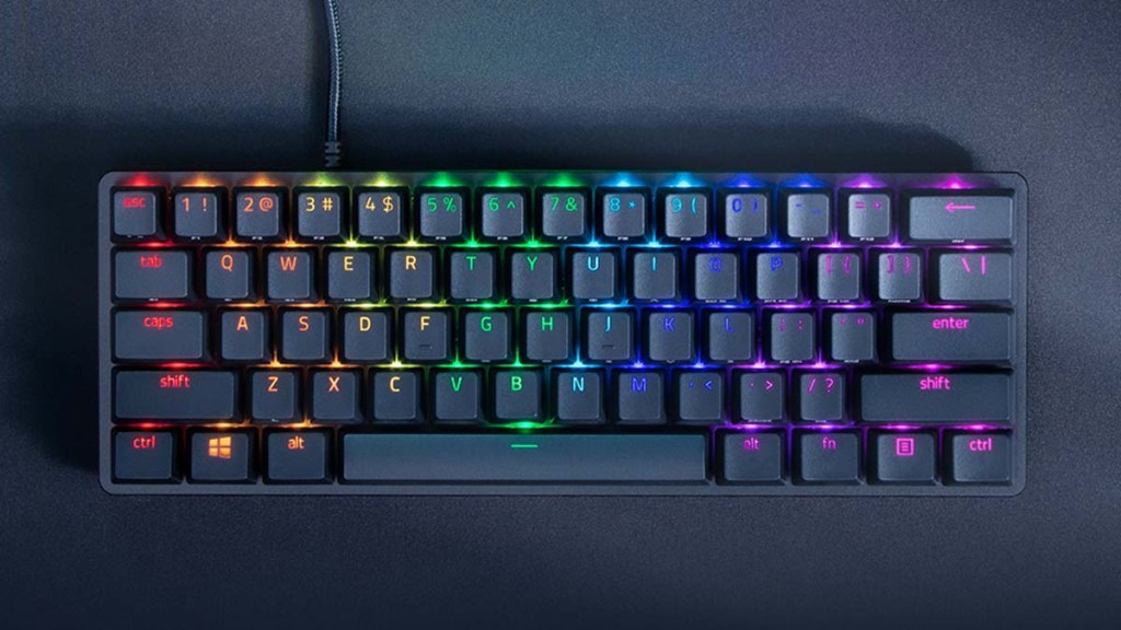 the razer huntsman mini with its RGB lights on.