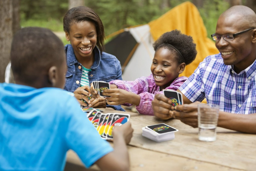 Family playing UNO All Wild