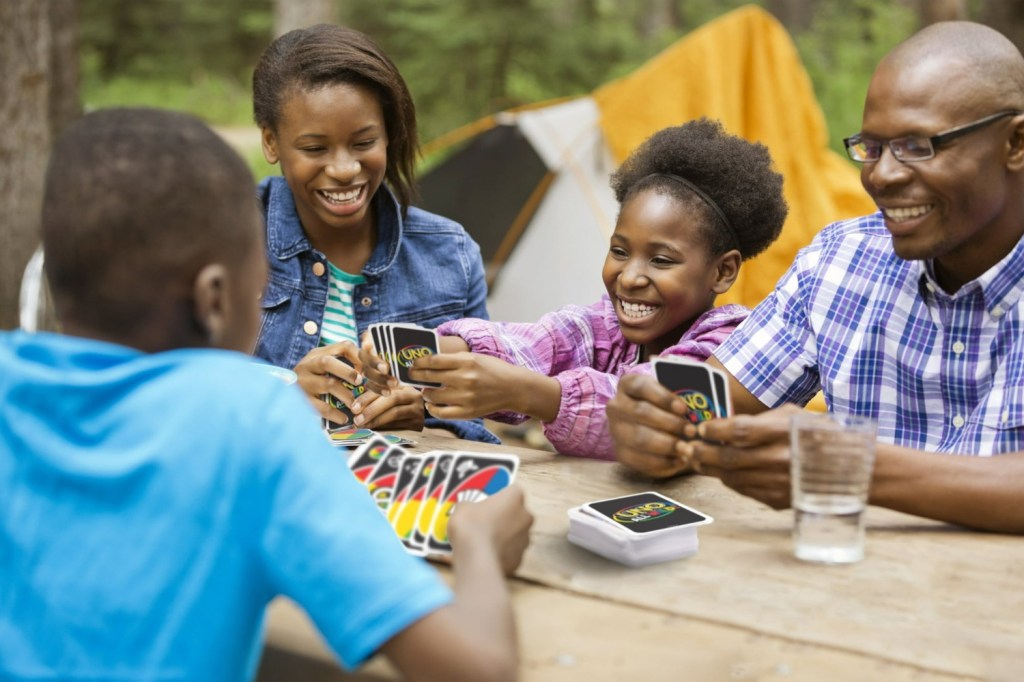 Family playing UNO All Wild