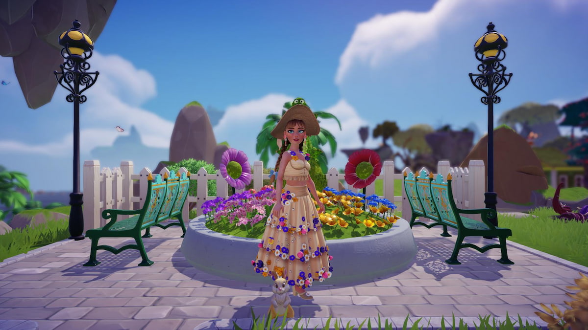 A character with long brown braids wearing a long floral dress and standing with a yellow bunny in front of a green flower bush in Disney Dreamlight Valley.