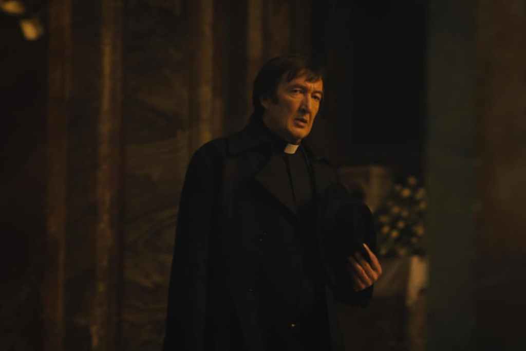 Ralph Ineson dressed formally while acting.