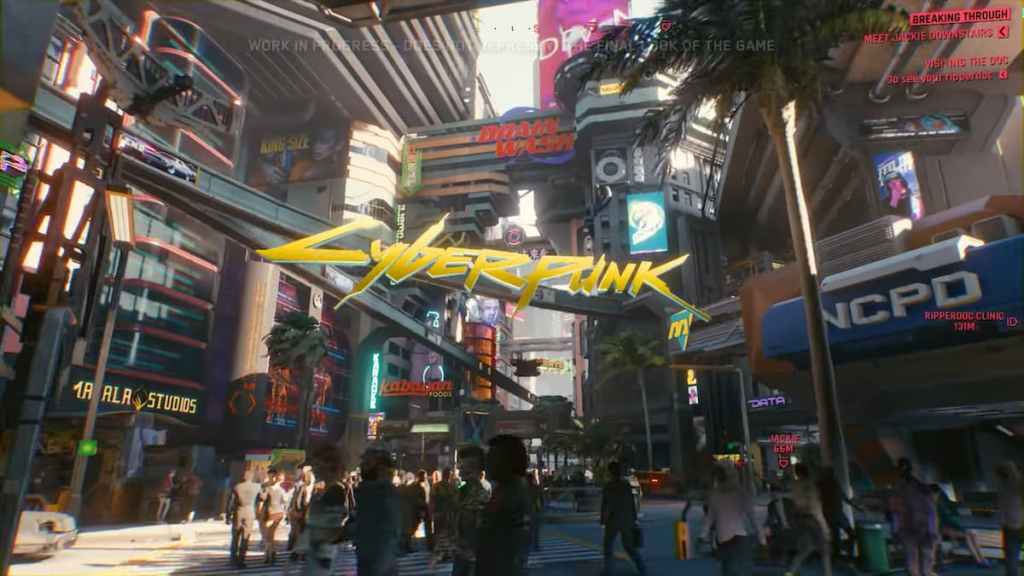 A crowd of people walking along the downtown areas of Night City in a 2018 demo of Cyberpunk 2077. 