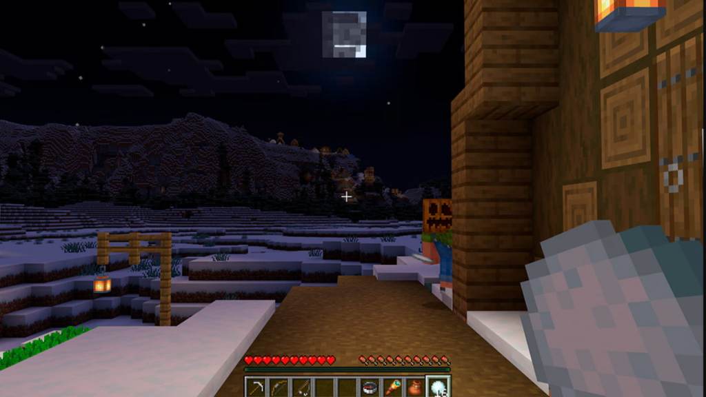 A player wearing a carved pumpkin mask hiding from the player locator bar in minecraft