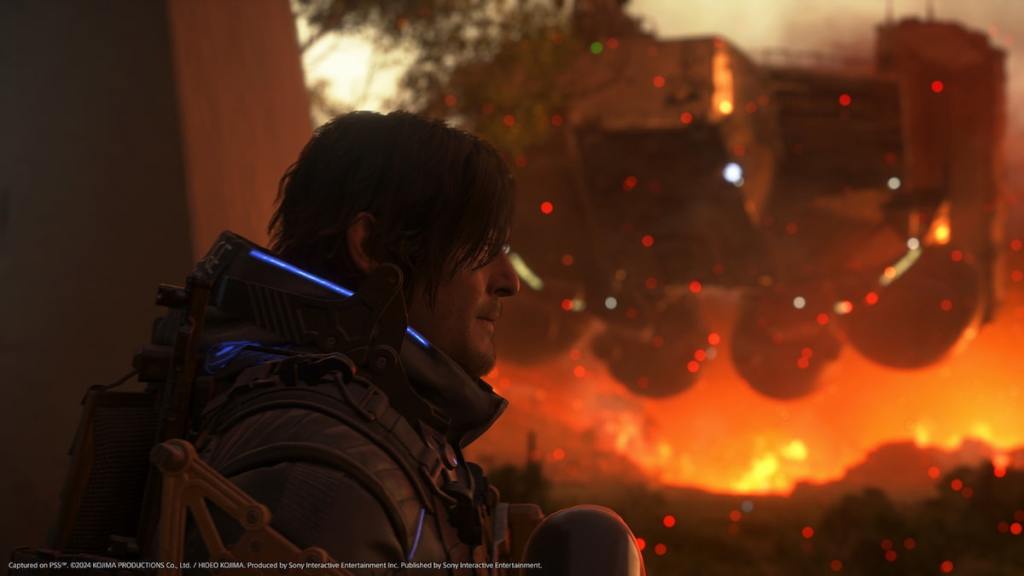 Death Stranding 2 Sam with fire in the background screenshot