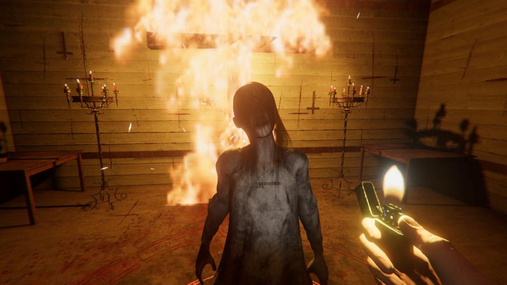 A ghost in front of a flaming cross in Phasmophobia
