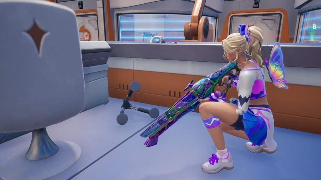 Haylee Skye, a cheerleader with blonde hair and a white, pink, and purple outfit, kneeling by a surveillance gear stand in Fortnite