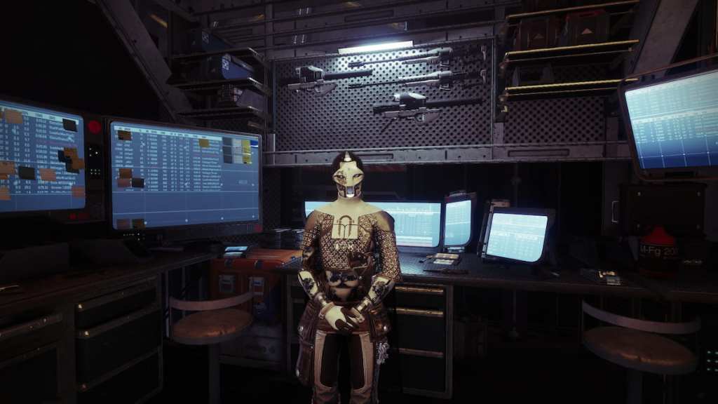 Ada-1, as seen in the shooting range, with bits of machinery and other gear behind her.