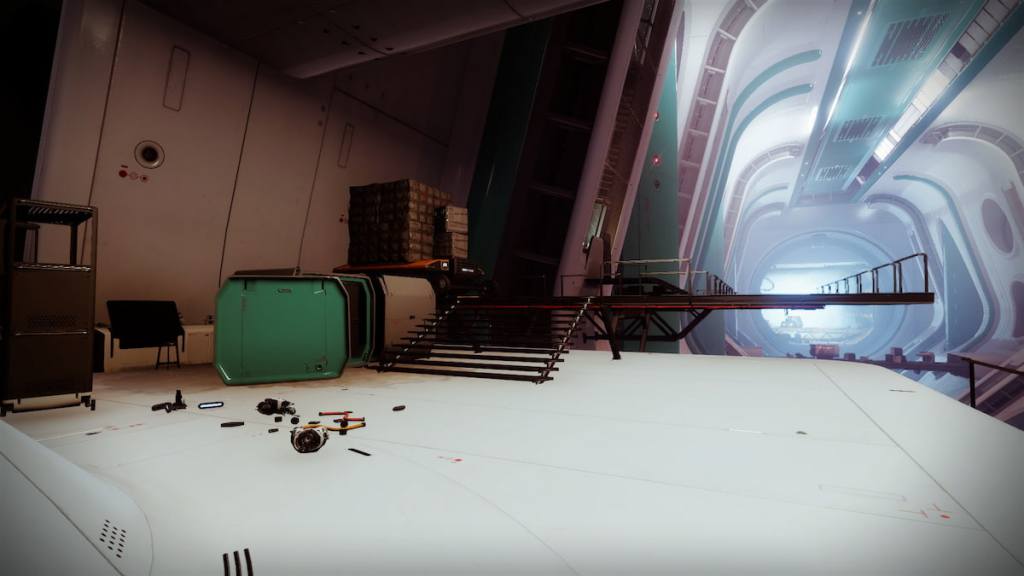 A part of Creation in Destiny 2. Some crates are visible on the left of the image, where a data pad is hidden.