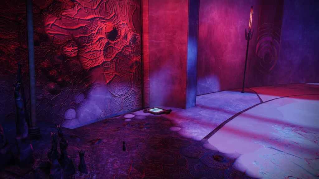 The second data pad in Kell's Fall is by a wall.