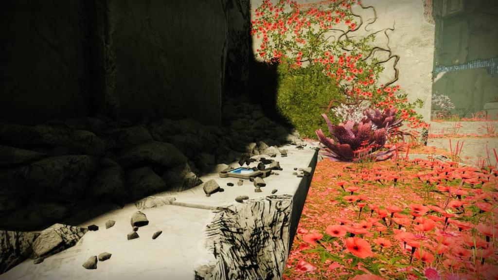 A data pad lies on a Vex rock in the Black Garden, surrounded by red plants and green grass.