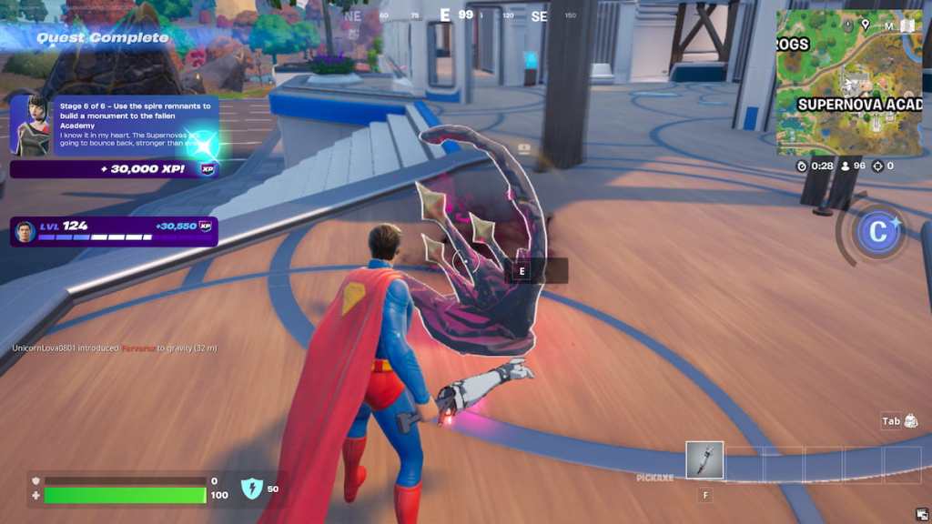 Superman building a grey, rocky spire monument with three golden stars on it in Fortnite