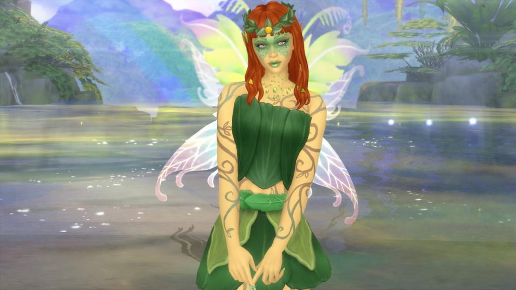 A fairy with green skin, a leafy green dress, green and pink wings, and orange hair standing in front of a sparkling pond and rainbow in The Sims 4