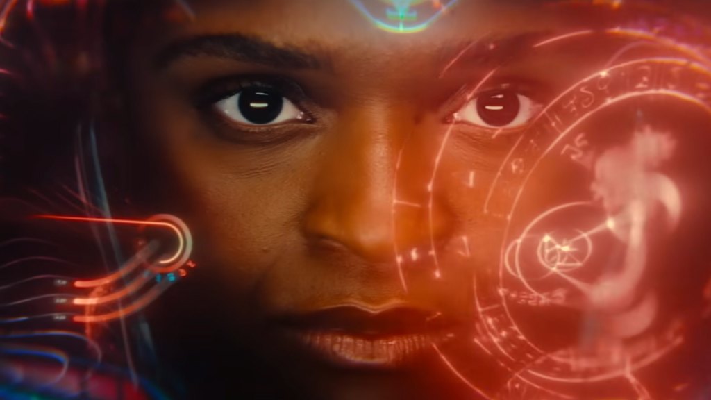 A close up shot of riri williams face in her suit with tech and magic swirling around her in ironheart