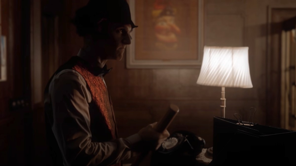 Side shot of Jimmy Hall holding a bat at the front desk in At Dead of Night