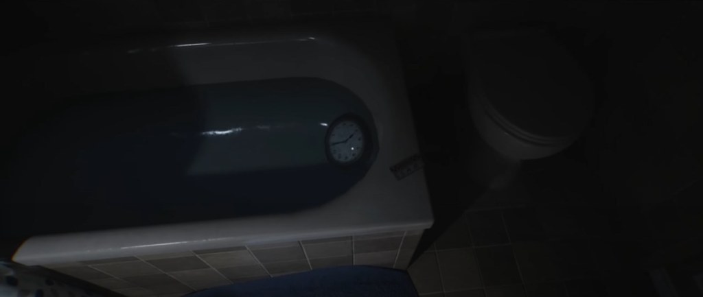 Clock submerged in bathtub