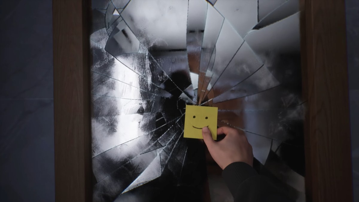 Picking up the smiley face post-it off the broken mirror