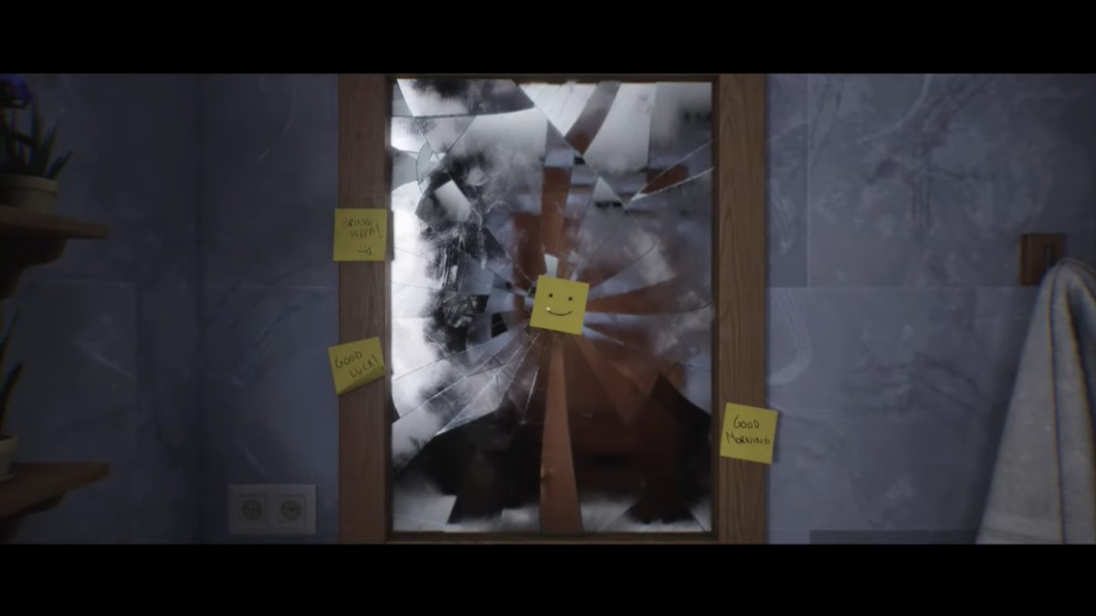 Luto broken mirror with smiley post-it note at its center