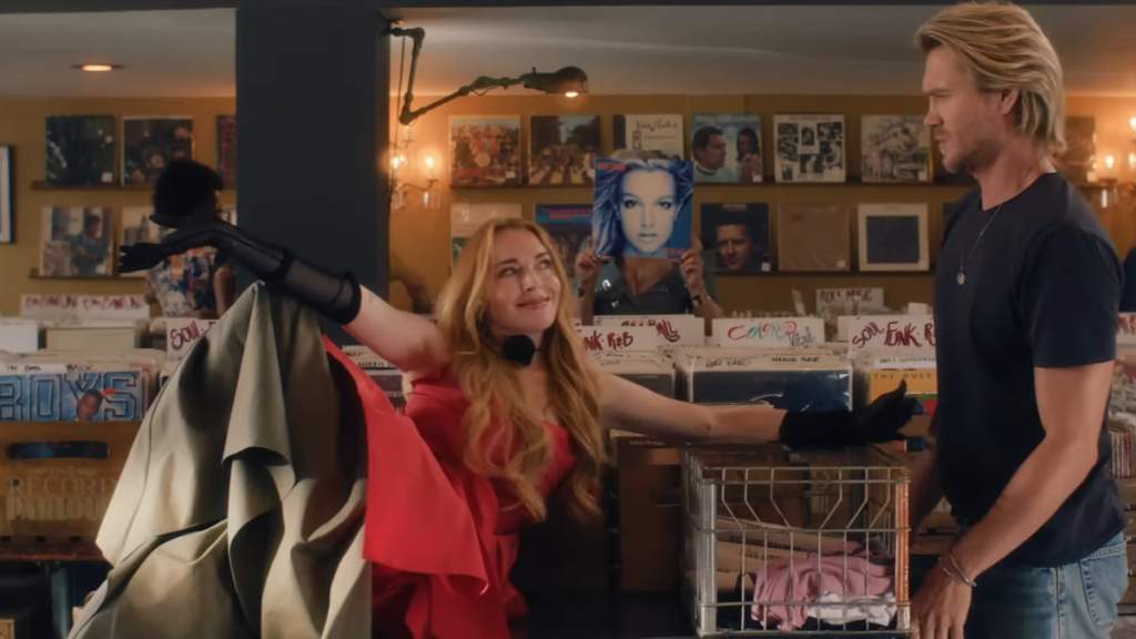 Anna posing on a table in a record store by her ex Jake in Freakier Friday