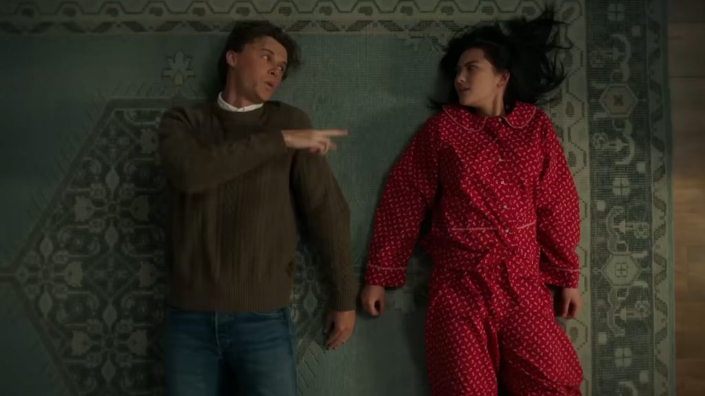 Conrad pointing at Belly while on the ground next to her in the summer i turned pretty