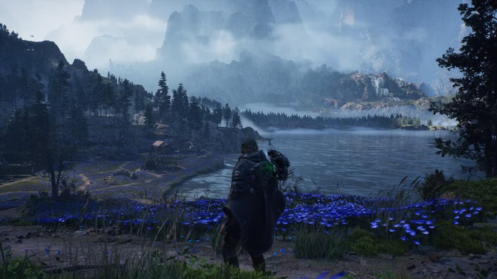 A serene field and lake with mountains and waterfalls in the background in Hell is Us. 