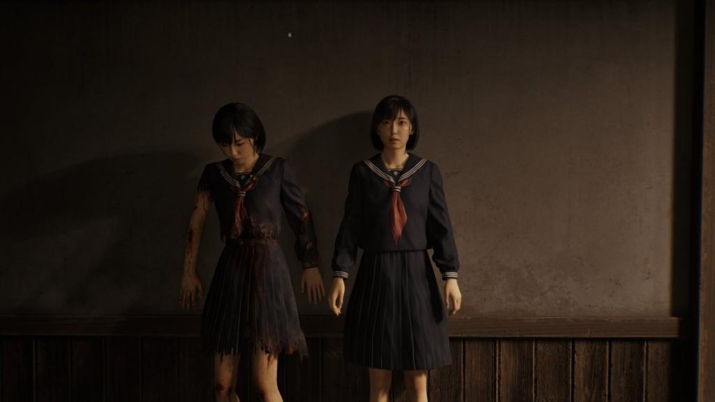 The two selves of Hinako standing up against a wall