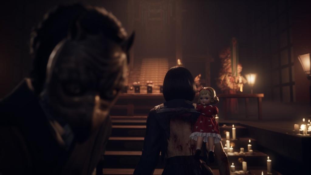 Junko's owl face slightly blurred, camera focused on the back of Hinako with doll riding on her shoulder