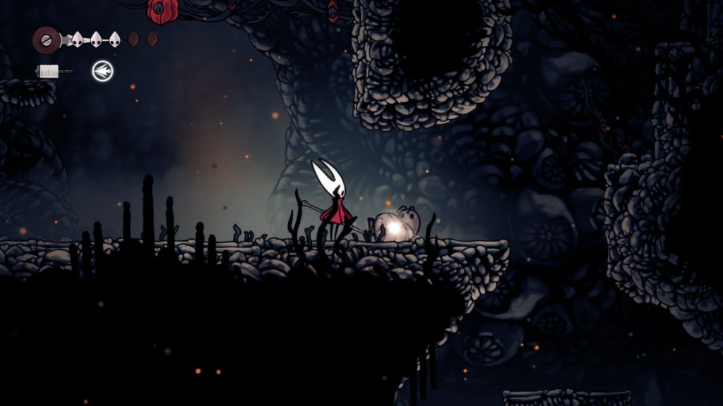 An enemy with a dropped Pilgrim Garb in Hollow Knight: Silksong.