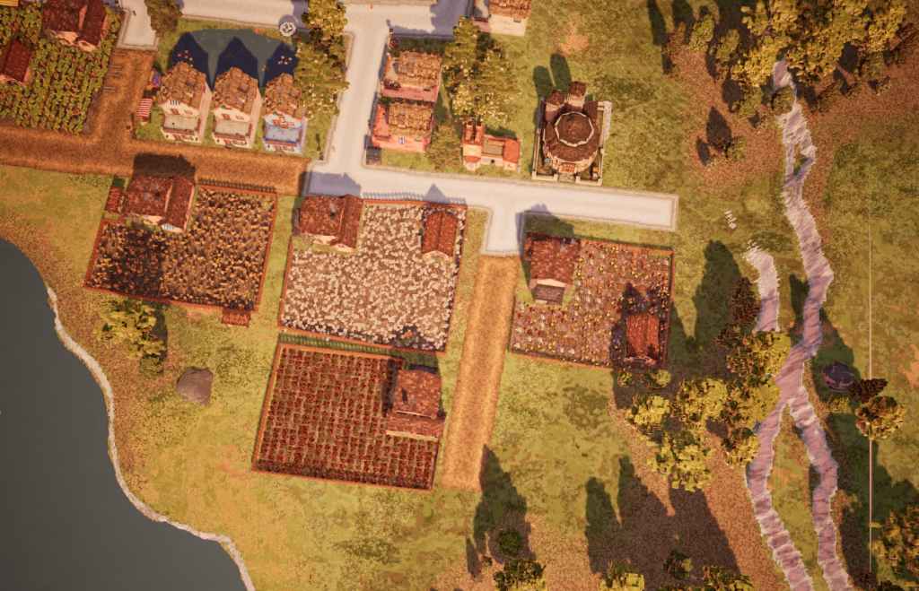 Several farms lie in a field and they are surrounded by uneven fencing.