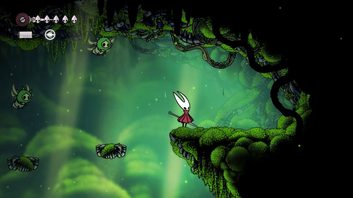 Hornet standing next to where the first Mossberry is located in Silksong.