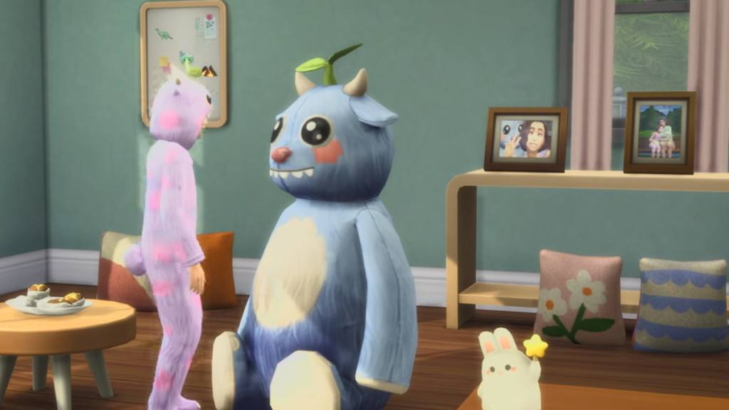 A child sim in a monster onesie looking at a monster plush in a room with some photos on a table in the sims 4