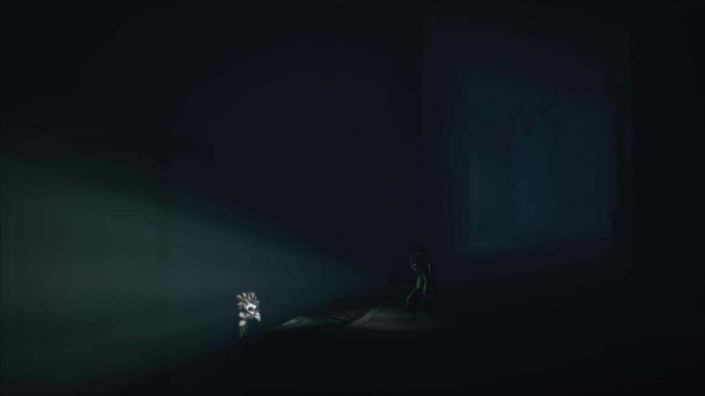 Shining the flashlight at Low and the staircase leading down to another doll