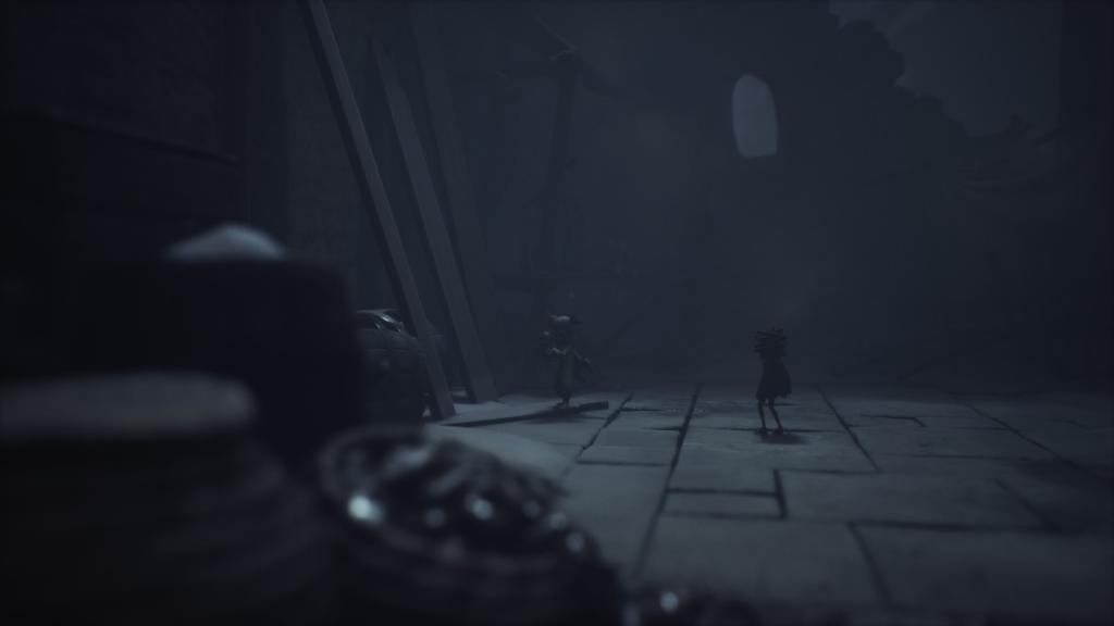 Looking at the doll on the floor at the end of the ruined corridor